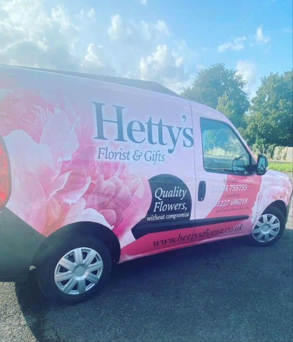 Hetty's Florist pink delivery van parked outdoors