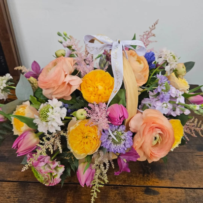 Sherbet Twist - This delightful collection of seasonal blooms is a beautiful way to send your affections. A pretty arrangement in a classic basket simply fizzing with joy and character.
