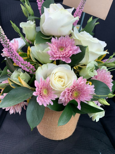 Pot of Happiness - A small but choice selection of flowers arranged in a petite container.