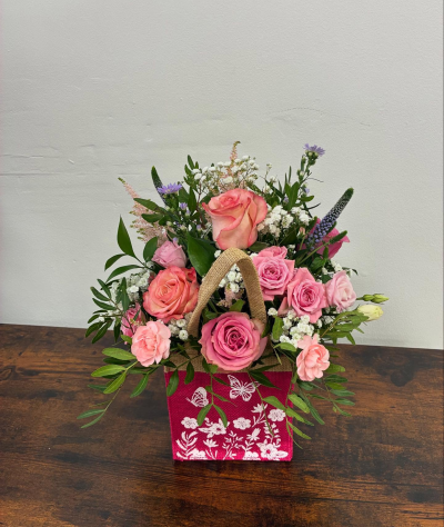 A Little Something - Show your affection with this mouth-watering mix of classical flowers delivered in a delightful gift bag or box.