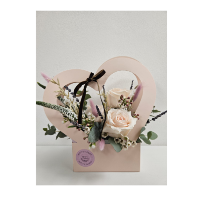I Love you Mum - Celebrate Mum with this beautiful heart-shaped floral arrangement, designed to show just how much she means to you.